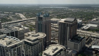 AX0034_088E - 5K aerial stock footage of flying over Downtown and approaching SunTrust Center, Downtown Orlando, Florida