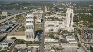 AX0034_094E - 5K aerial stock footage of following Orange Avenue through Downtown Orlando, Florida