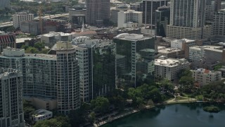 AX0034_105 - 5K aerial stock footage of condominium complex and office buildings, Downtown Orlando, Florida