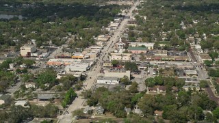AX0034_113 - 5K aerial stock footage of a small church and shops beside a busy street, Orlando, Florida