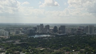 AX0035_002 - 5K aerial stock footage video of Downtown Orlando and Lake Eola, Florida