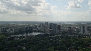 AX0035_003 - 5K aerial stock footage of Downtown Orlando buildings along Lake Eola, Florida