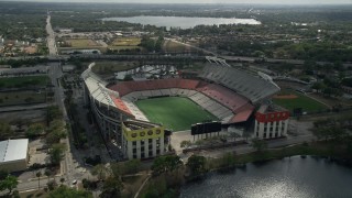 AX0035_007E - 5K aerial stock footage of approaching Lake Lorna Doone and Citrus Bowl football stadium, Orlando, Florida