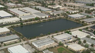 AX0035_009 - 5K aerial stock footage of toy speedboat in a pondo, Orlando, Florida