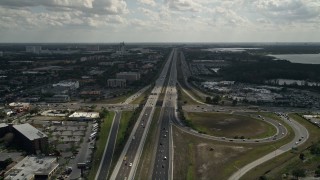 AX0035_027E - 5K aerial stock footage of following an interstate with light traffic, Orlando, Florida