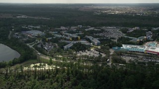 AX0035_044 - 5K aerial stock footage of approaching Disney's All Star Sports Resort, Orlando, Florida
