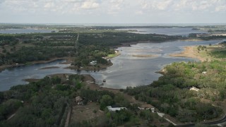 AX0035_097 - 5K aerial stock footage of homes on the shore of Lake Avalon, Florida