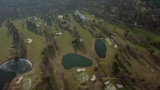 AX0065_0017 - 5K aerial stock footage of a bird's eye view of Tam O'Shanter Golf Club in Brookville, Long Island, New York, winter