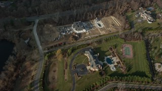 AX0065_0022 - 5K aerial stock footage tilt and pass by large mansions in Greenvale, Long Island, New York, winter