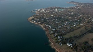 AX0065_0027E - 5K aerial stock footage of upscale, waterfront homes by Little Neck Bay in Great Neck, Long Island, New York, winter