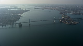 AX0065_0029 - 5K aerial stock footage approach Throgs Neck Bridge spanning the East River, Long Island, New York, winter