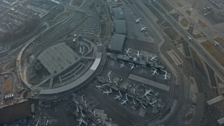 AX0065_0037E - 5K aerial stock footage of a bird's eye view of LaGuardia Airport, Queens, New York City, winter