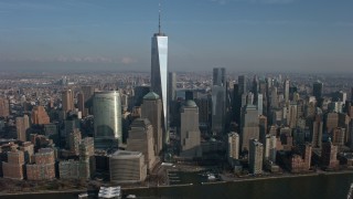 AX0065_0070E - 5K aerial stock footage of Freedom Tower, World Trade Center skyscrapers in Lower Manhattan, New York City, winter
