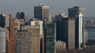 AX0065_0096 - 5K aerial stock footage of flying by skyscrapers in Lower Manhattan, New York City, winter, revealing Brooklyn skyscrapers across the East River