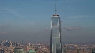AX0065_0115 - 5K aerial stock footage tilt up to the spire atop Freedom Tower in Lower Manhattan, New York City, winter