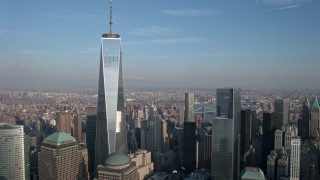 AX0065_0124 - 5K aerial stock footage reverse view of Freedom Tower in Lower Manhattan, New York City, winter
