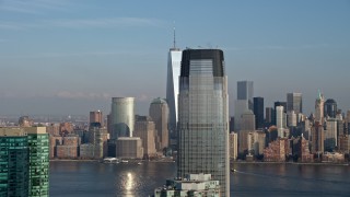 AX0065_0126E - 5K stock footage aerial video of Freedom Tower and the Lower Manhattan skyline, reveal Goldman Sachs Tower, New York City, winter
