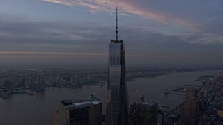 AX0065_0203 - 5K aerial stock footage of orbiting Freedom Tower in Lower Manhattan with Hudson River in the background, New York City, winter, sunset