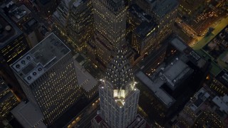 AX0065_0241 - 5K aerial stock footage tilt to a bird's eye view of the Chrysler Building in Midtown Manhattan, New York City, winter, twilight