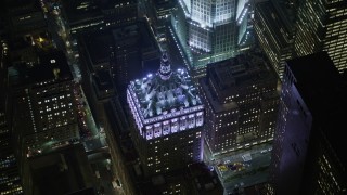 AX0065_0341E - 5K aerial stock footage orbit the Helmsley Building in Midtown Manhattan, New York City, winter, night