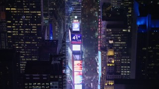 AX0065_0346 - 5K aerial stock footage approach the large screens and 2014 New Years ball at Times Square, New York City, winter, night