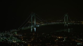 AX0065_0398 - 5K aerial stock footage flyby the Verrazano-Narrows Bridge in New York City, winter, night