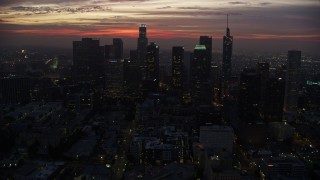 AX0156_044 - 7.6K stock footage aerial video on approach to the Downtown Los Angeles skyline at sunrise, California