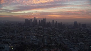 AX0156_072 - 7.6K stock footage aerial video of golden clouds above Downtown Los Angeles skyline, California early in the morning