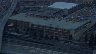 AX0156_089 - 7.6K aerial stock footage of Police Helicopters at LAPD Air Support Division in Downtown Los Angeles, California at sunrise