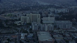 AX0156_093E - 7.6K aerial stock footage orbiting General Hospital at USC Health Sciences Campus in Boyle Heights, Los Angeles, California at sunrise