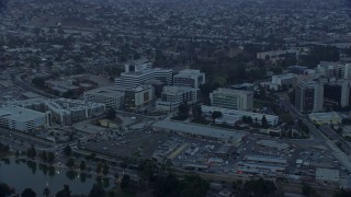 AX0156_096E - 7.6K aerial stock footage of Keck Hospital of University of Southern California in Boyle Heights, Los Angeles, California at sunrise