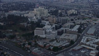 AX0156_098 - 7.6K stock footage aerial video of Keck Hospital and General Hospital of University of Southern California in Boyle Heights, Los Angeles, California at sunrise
