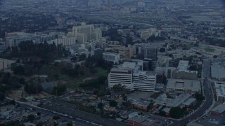 AX0156_098E - 7.6K aerial stock footage of Keck Hospital and General Hospital of University of Southern California in Boyle Heights, Los Angeles, California at sunrise