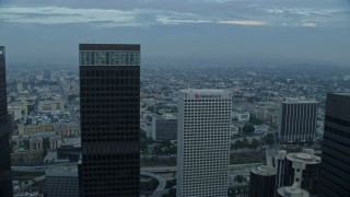 AX0156_115E - 7.6K aerial stock footage flying through Downtown Los Angeles, California at sunrise, and reveal Westlake