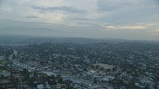 AX0156_117 - 7.6K aerial stock footage flying by residential neighborhoods in Echo Park and Silver Lake at sunrise, Los Angeles, California