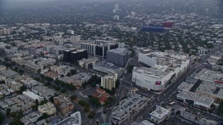 AX0156_124 - 7.6K stock footage aerial video circling around Beverly Center and Cedars-Sinai Medical Center at sunrise, Beverly Hills, California
