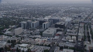 AX0156_125 - 7.6K stock footage aerial video orbiting Cedars-Sinai Medical Center at sunrise in Beverly Hills, California