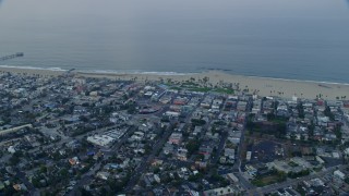 AX0156_152 - 7.6K aerial stock footage of Venice Beach and Windward Plaza at sunrise in Venice, California