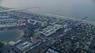 AX0156_153 - 7.6K aerial stock footage flying over Venice toward Marina Del Rey condominium complexes at sunrise, California