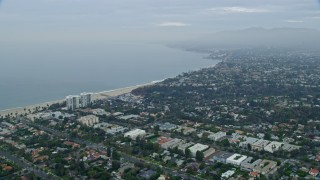 AX0156_159 - 7.6K aerial stock footage flying over neighborhoods in Santa Monica and Pacific Palisades, California in the morning