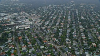 AX0156_160 - 7.6K aerial stock footage flying over upscale homes in the morning, Pacific Palisades, California