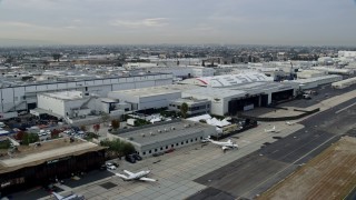 AX0156_204 - 7.6K stock footage aerial video of SpaceX HQ and Tesla Design Center at Hawthorne Airport, California