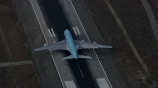 AX0157_006E - 7.6K aerial stock footage of Korean Air A380 landing at LAX, Los Angeles, California
