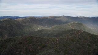 AX0157_016 - 7.6K stock footage aerial video of rolling green Santa Monica Mountains, California