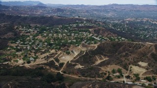 AX0157_020E - 7.6K aerial stock footage of a small neighborhood in the hills of Topanga, California