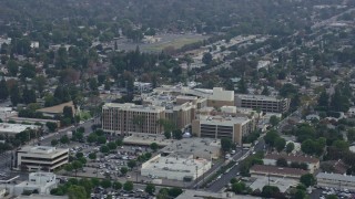 AX0157_065E - 7.6K aerial stock footage orbiting the side of Northridge Hospital in Northridge, California