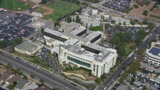 AX0157_075E - 7.6K aerial stock footage approach and orbit Providence Holy Cross Medical Center in Mission Hills, California