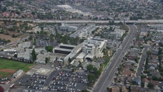 AX0157_077E - 7.6K aerial stock footage of the Providence Holy Cross Medical Center in Mission Hills, California