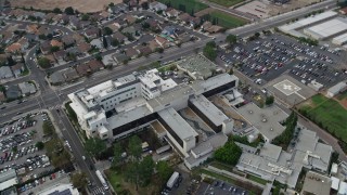 AX0157_080 - 7.6K aerial stock footage orbiting Providence Holy Cross Medical Center in Mission Hills, California
