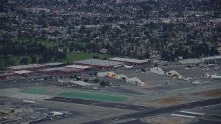 AX0158_002 - 7.6K stock footage aerial video of a private jet taking off from Burbank airport, twilight, Burbank, California